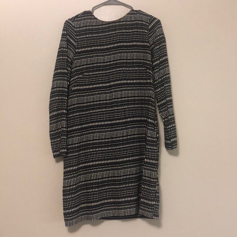 Black and white patterned, above the knee dress